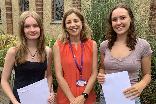 Headteacher, Mrs Macallister (centre) with successful students