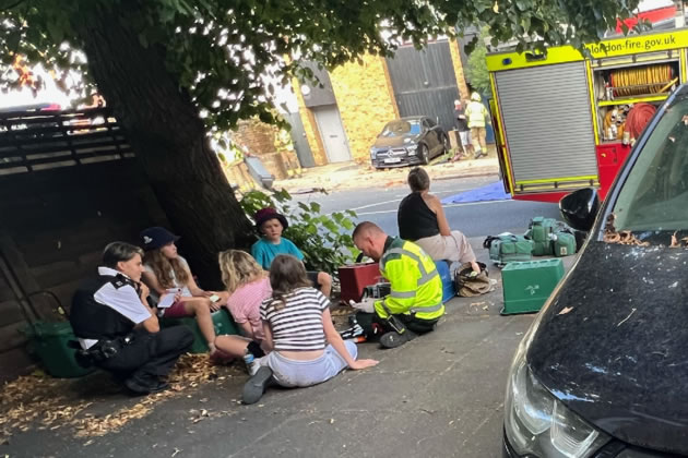 Emergency service workers comfort families at the scene